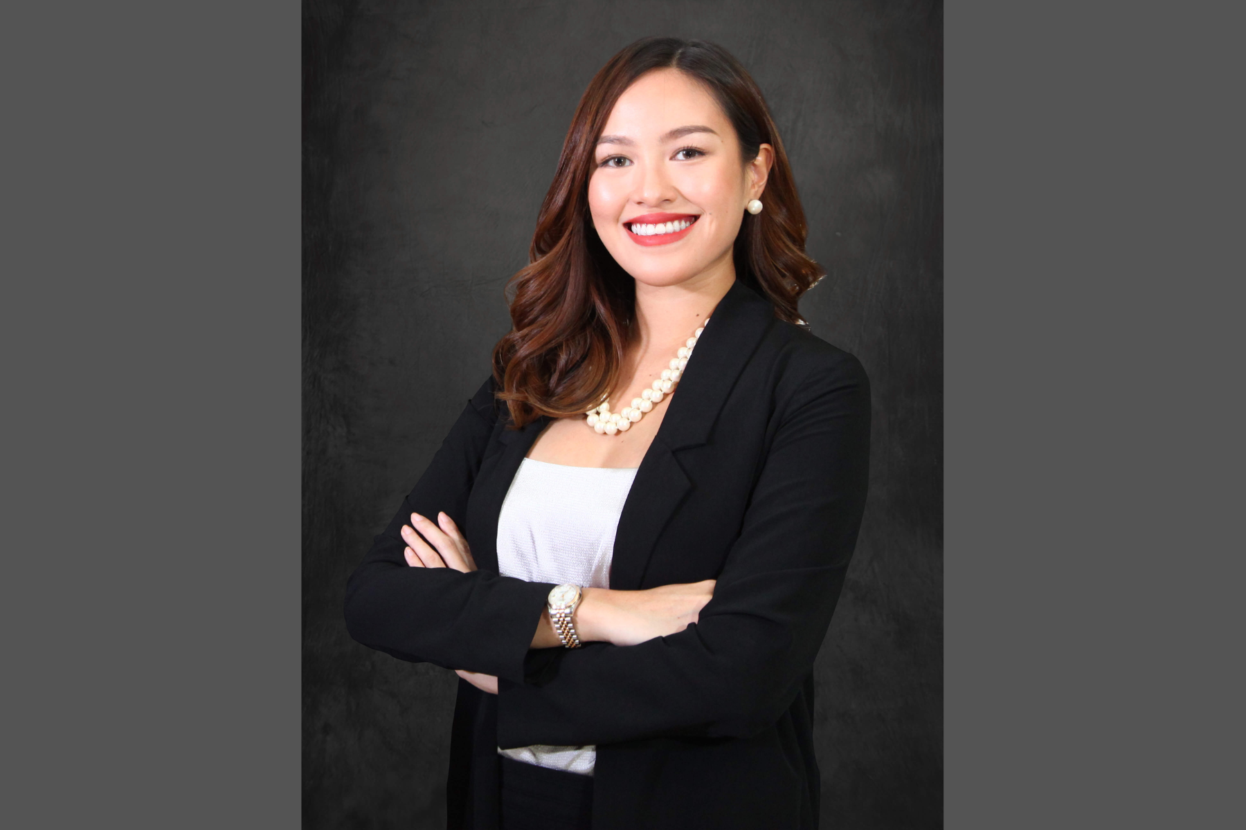 Jo Robles wearing a formal attire on a dark gradient background